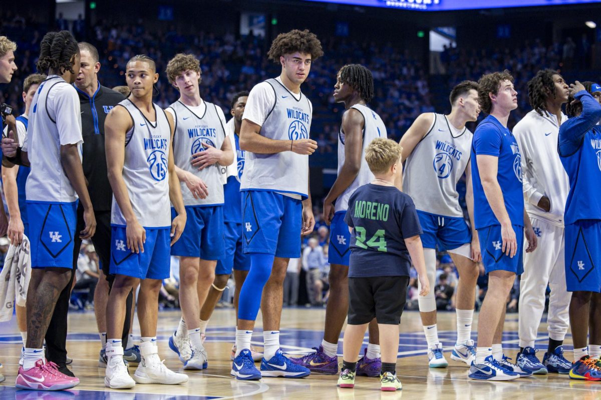 Malachi Moreno, center, stands with a fan during Big Blue Madness on Saturday, Oct. 11, 2025, at Rupp Arena in Lexington, Ky. Photo by Christian Kantosky | Photo Editor