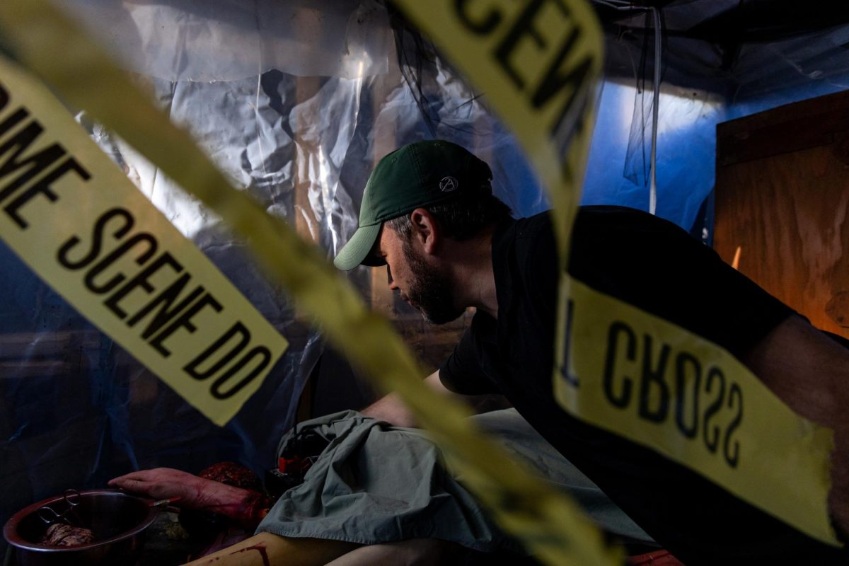 Michale Cronk fixes an animatronic inside of ‘A Haunting on Lincoln Avenue’ on Thursday, Oct. 16, 2025, at his home in Lexington, Ky. Photo by Sydney Novack | Assistant Photo Editor