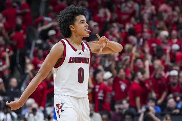 Louisville Cardinals guard Mikel Brown Jr. (0) celebrates after hitting a 3-point shot during the men’s basketball game against Louisville on Tuesday, Nov. 11, 2025, at KFC Yum! Center in Louisville, Ky. Louisville won 96-88. Photo by Christian Kantosky | Photo Editor