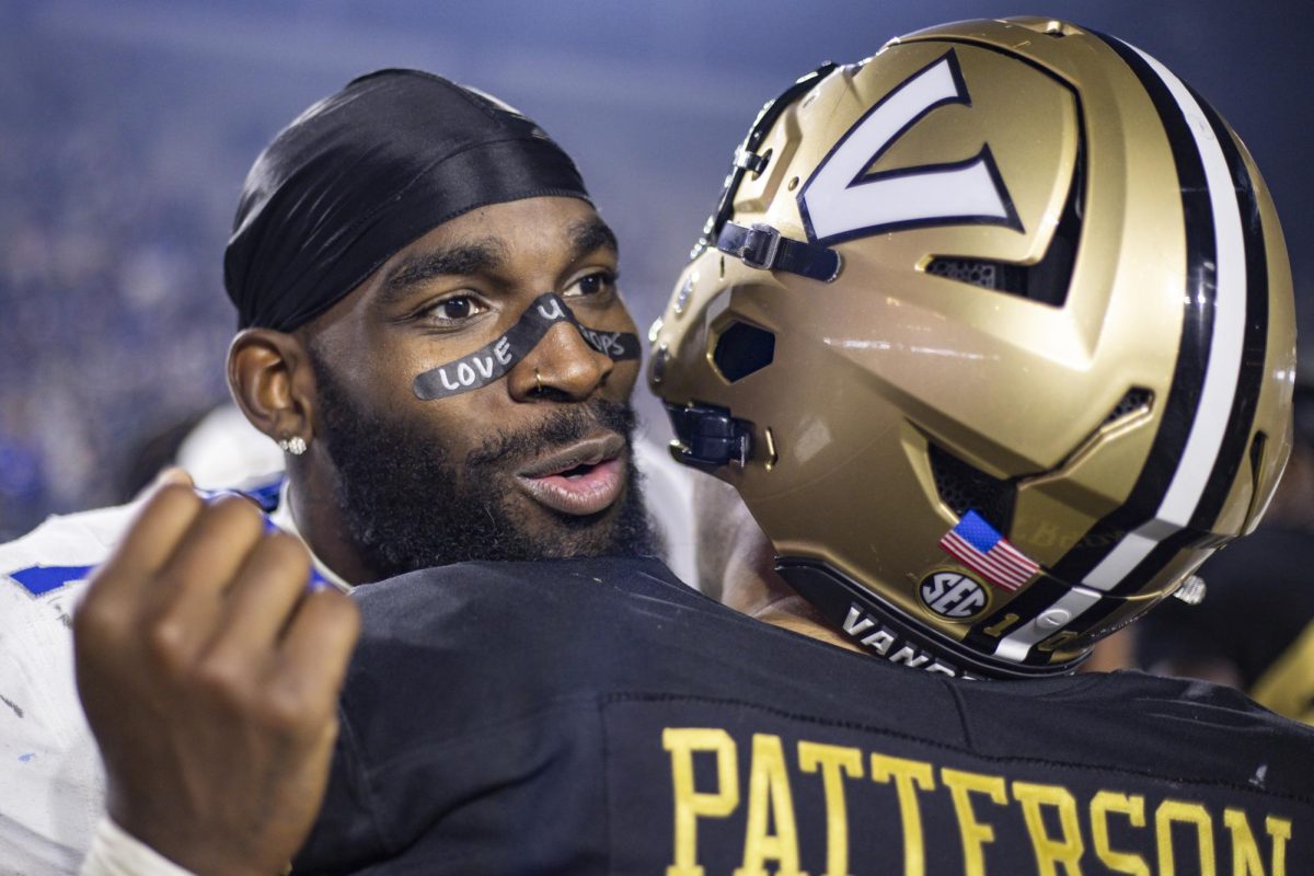 Kentucky Wildcats linebacker Daveren Rayner (7) hugs Vanderbilt Commodores linebacker Langston Patterson (10) after the football game against Vanderbilt on Saturday, Nov. 22, 2025, at FirstBank Stadium in Nashville, Tenn. Vanderbilt won 45-17. Photo by Christian Kantosky | Photo Editor