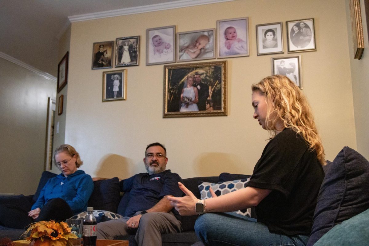 Michelle Castro, left, and Jorge Castro, middle, listens to Julie Castro, right, speak during an interview with the Kentucky Kernel on Wednesday, Nov. 5, 2025, in the Castro's house in Lexington, Ky. Photo by Brooke Johnson | Staff