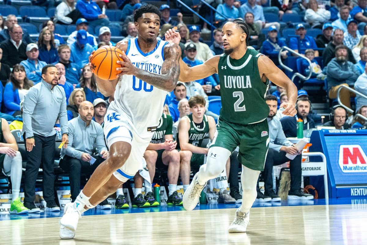 Kentucky Wildcats guard Otega Owen (00) drives to the basket during the men’s basketball game against Loyola on Friday, Nov. 21, 2025, at Rupp Arena in Lexington, Ky. Photo by Will Luckett | Staff