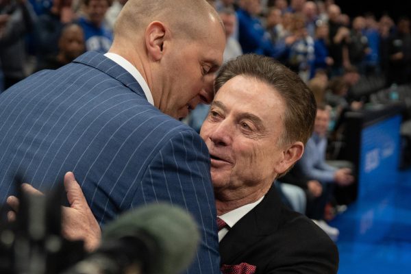University of Kentucky Head Coach Mark Pope (Left) and St. Johns University Head Coach Rick Pitino (Right) embrace as UK beats St. John's 78-66 at the CBS Sports Classic in State Farm Arena, Atlanta, Ga. Photo taken by Peyton Tindall | Staff