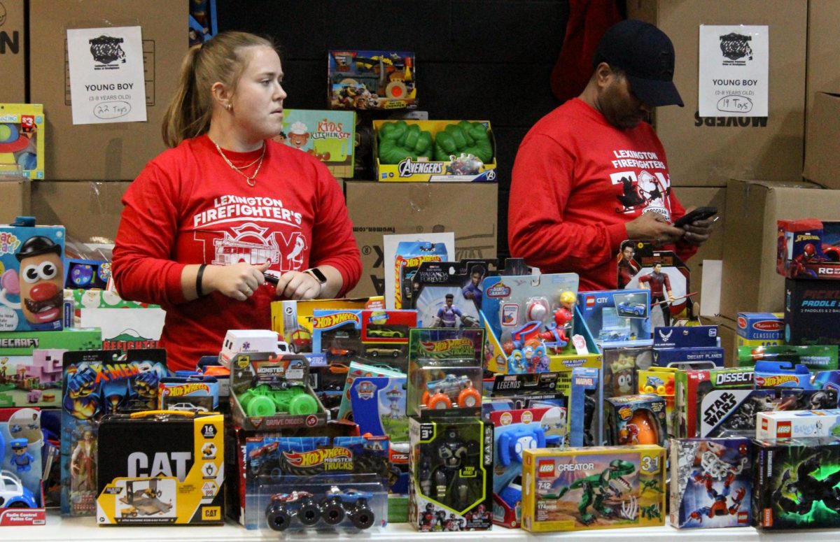 Volunteers wait for attendees to arrive during The Lexington Firefighter’s Toy Program Giveaway Day on Saturday, Dec. 20, 2025 in Lexington, Ky. Photo by Ellen Mueller | Staff