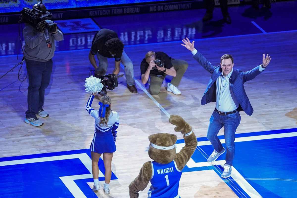 Kentucky football head coach Will Stein does the 'Y' during the basketball game against North Carolina on Tuesday, Dec. 2, 2025, at Rupp Arena in Lexington, Ky. Photo by Christian Kantosky | Photo Editor