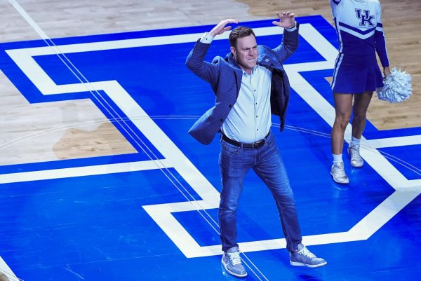 Kentucky football head coach Will Stein does the 'Y' during the basketball game against North Carolina on Tuesday, Dec. 2, 2025, at Rupp Arena in Lexington, Ky. Photo by Christian Kantosky | Photo Editor