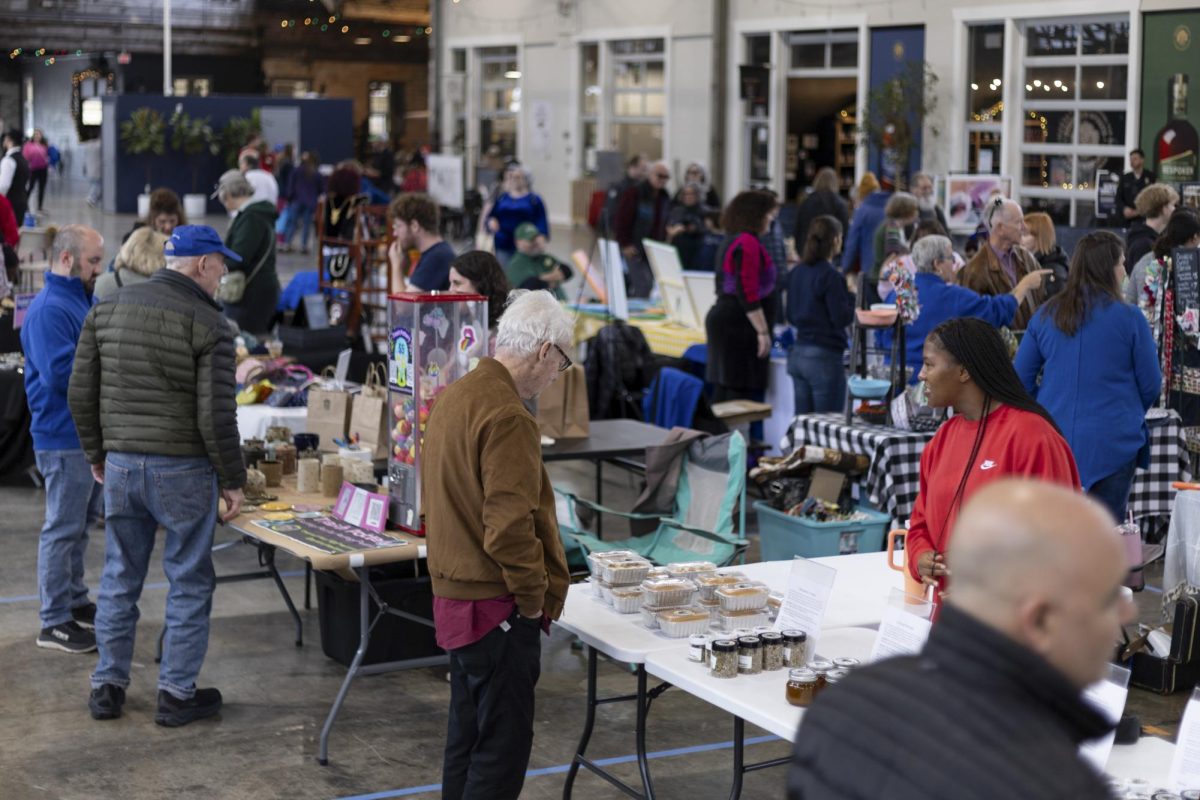 People gather to buy and sell different items during the Jewish Federation of the Bluegrass's 3rd annual Hanukkah Market on Sunday, Dec. 7, 2025, at Greyline Station in Lexington Ky. Photo by Gavin Breunig | Staff