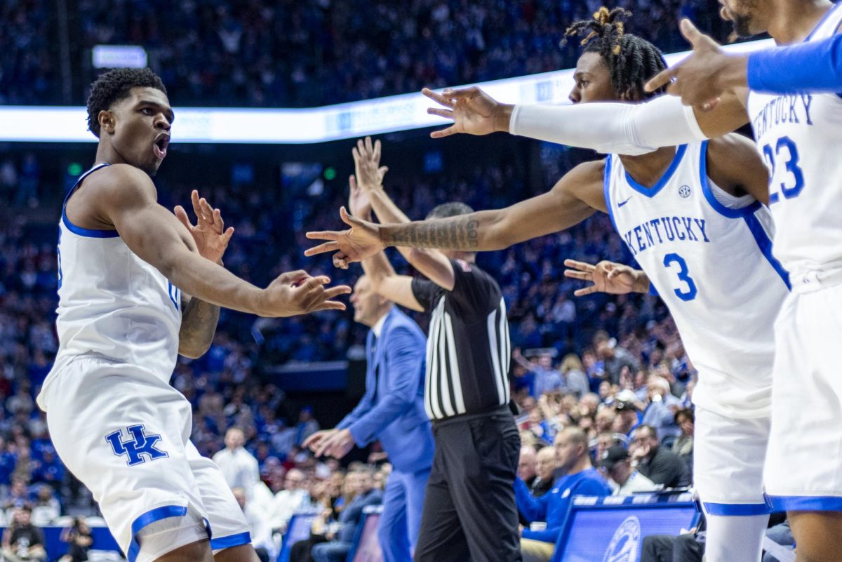Kentucky Wildcats guard Otega Oweh celebrates making a 3-point shot during the basketball game against Indiana on Saturday, Dec. 13, 2025, at Rupp Arena in Lexington, Ky. Kentucky won 72-60. Photo by Christian Kantosky | Photo Editor