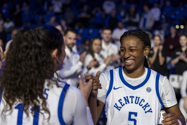 Kentucky guard Tonie Morgan (5) smiles at Kentucky guard Gabby Brooks (11) during the player introductions before the women’s basketball game against Wright State on Friday, Dec. 19, 2025, at the Historic Memorial Coliseum in Lexington, Ky. Kentucky won 96-53. Photo by Kate Bonafede | Staff