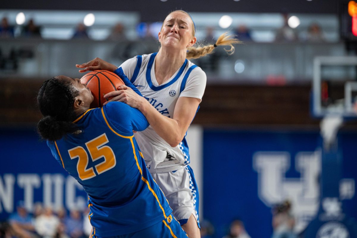 Kentucky guard Josie Gilvin (33) battles with Hofstra guard Micaela Carter (25) for a rebound during the Kentucky vs Hofstra women’s basketball game on Dec. 28, 2025, in Memorial Coliseum in Lexington, Ky. Photo by Jack Bates | Staff