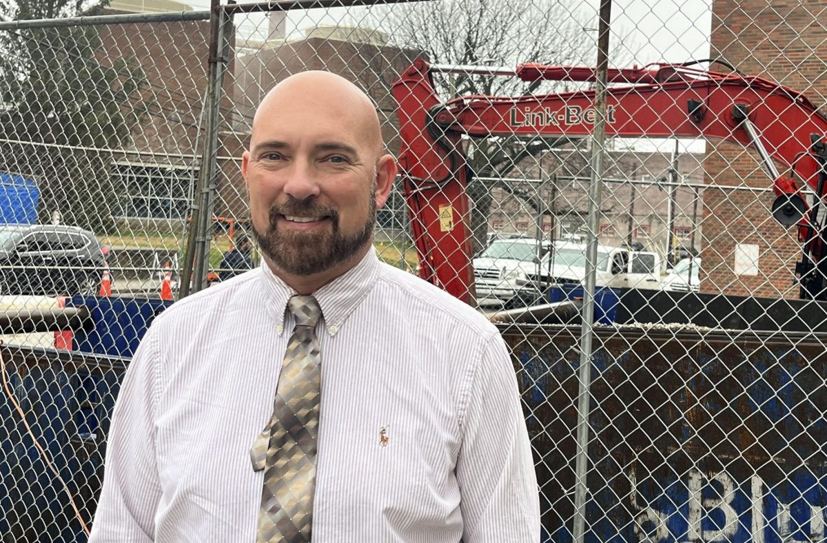 Joe Kelly, the director of facilities projects management at the University of Kentucky, poses for a photo in front of a construction project outside the Frank D. Peterson Service Building on Nov. 21, 2025 in Lexington, Ky. Photo by Casey Sebastiano | Staff