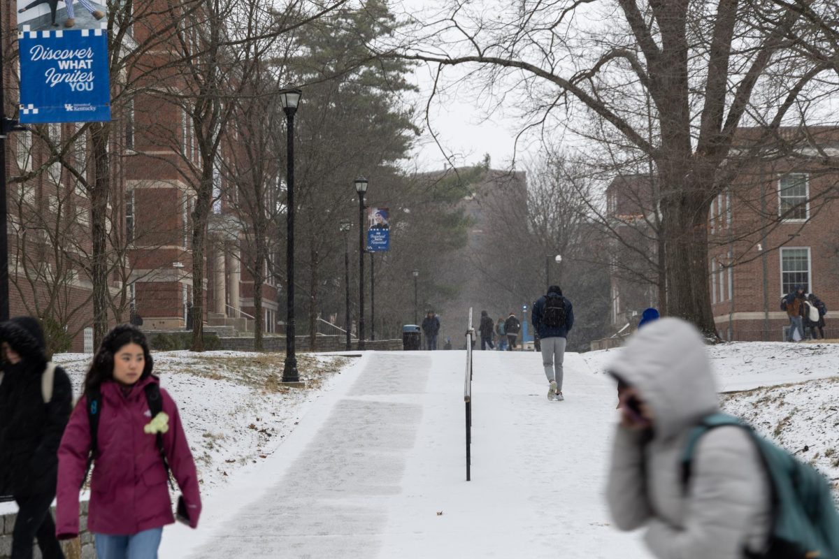Students walk on the unshoveled snow at the University of Kentucky on Wednesday, Jan. 21, 2026, on their way to class in Lexington, Ky. Photo by Brooke Johnson
