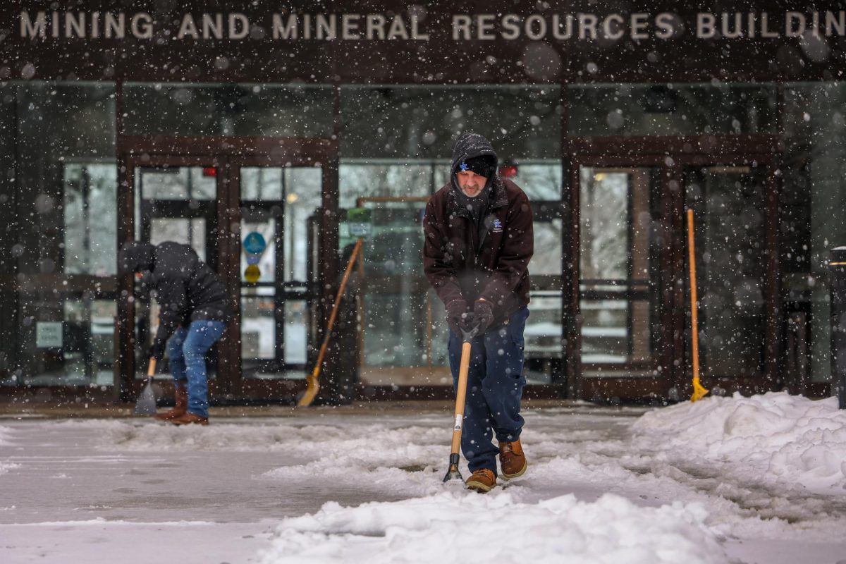 Fernando Rodriguez, left, and David Johnson, right, shovel the snow outside the Mining and Mineral Resources Building at the University of Kentucky on Sunday, Jan. 25, 2026, Lexington, Ky. Photo by Brooke Johnson | Photo Manager
