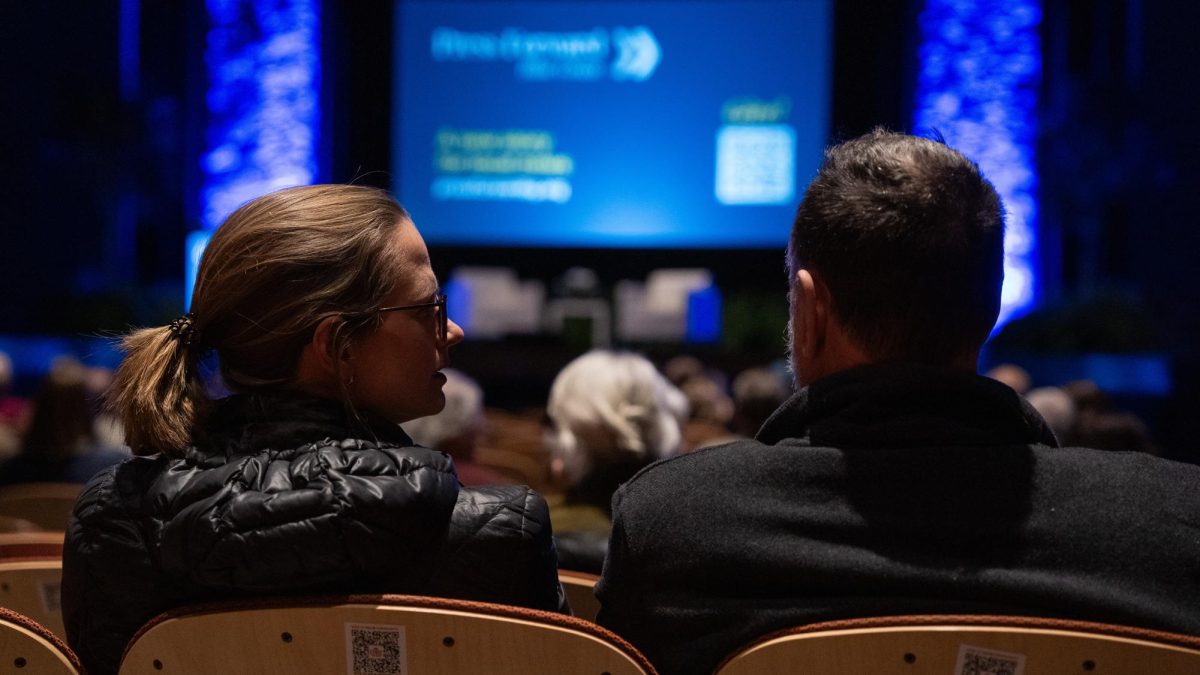 Attendees Chlodys Johnstone, left, and Fraser Johnstone, right,  discuss Charles Blow’s answers and premiere for his new documentary at the Lyric Theatre in Lexington, Ky. on Tuesday Feb. 24, 2026. Photo taken by Peyton Tindall | Kentucky Kernel

