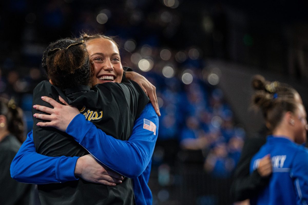 Kentucky and Missouri gymnasts embraces post-match after the Kentucky vs Missouri gymnastics meet on Feb 13, 2026, at Memorial Coliseum, in Lexington Ky. Missouri won 196.825-196.800. Photo by Jack Bates | Kentucky Kernel
