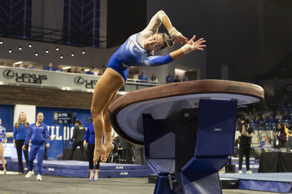 A Kentucky gymnast rotates off the spring board onto the vault platform during the women’s gymnastics meet against Missouri on Friday, Feb. 13, 2026, at Memorial Coliseum in Lexington, Ky. Missouri won 196.825 - 196.800. Photo by Kate Bonafede | Kentucky Kernel
