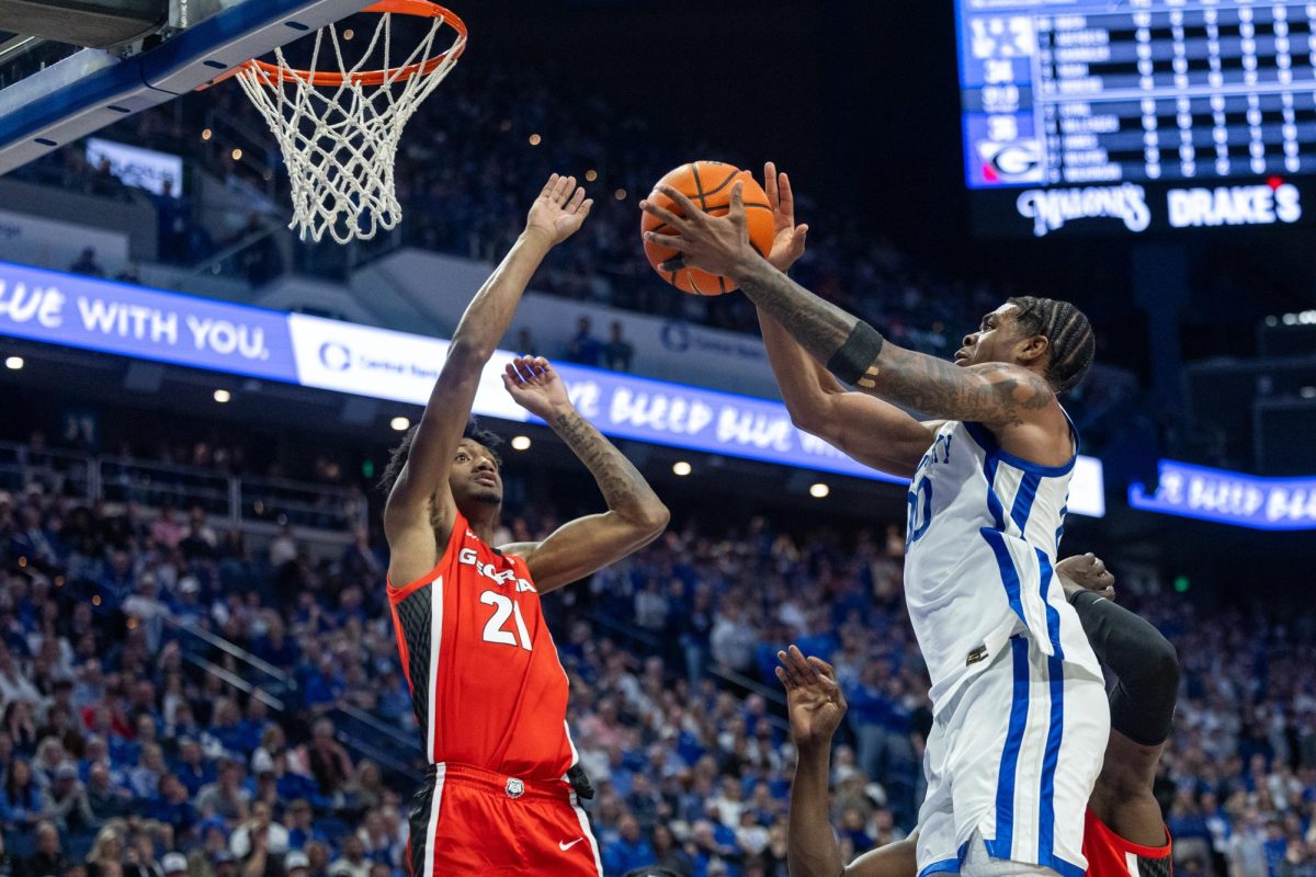 Kentucky Wildcats guard Otega Oweh (00) shoots the ball over Georgia forward Jake Wilkins (21) during the mens basketball game at Rupp Arena on Tuesday, Feb. 17, 2026, in Lexington, Ky. Photo by Brooke Johnson | Kentucky Kernel