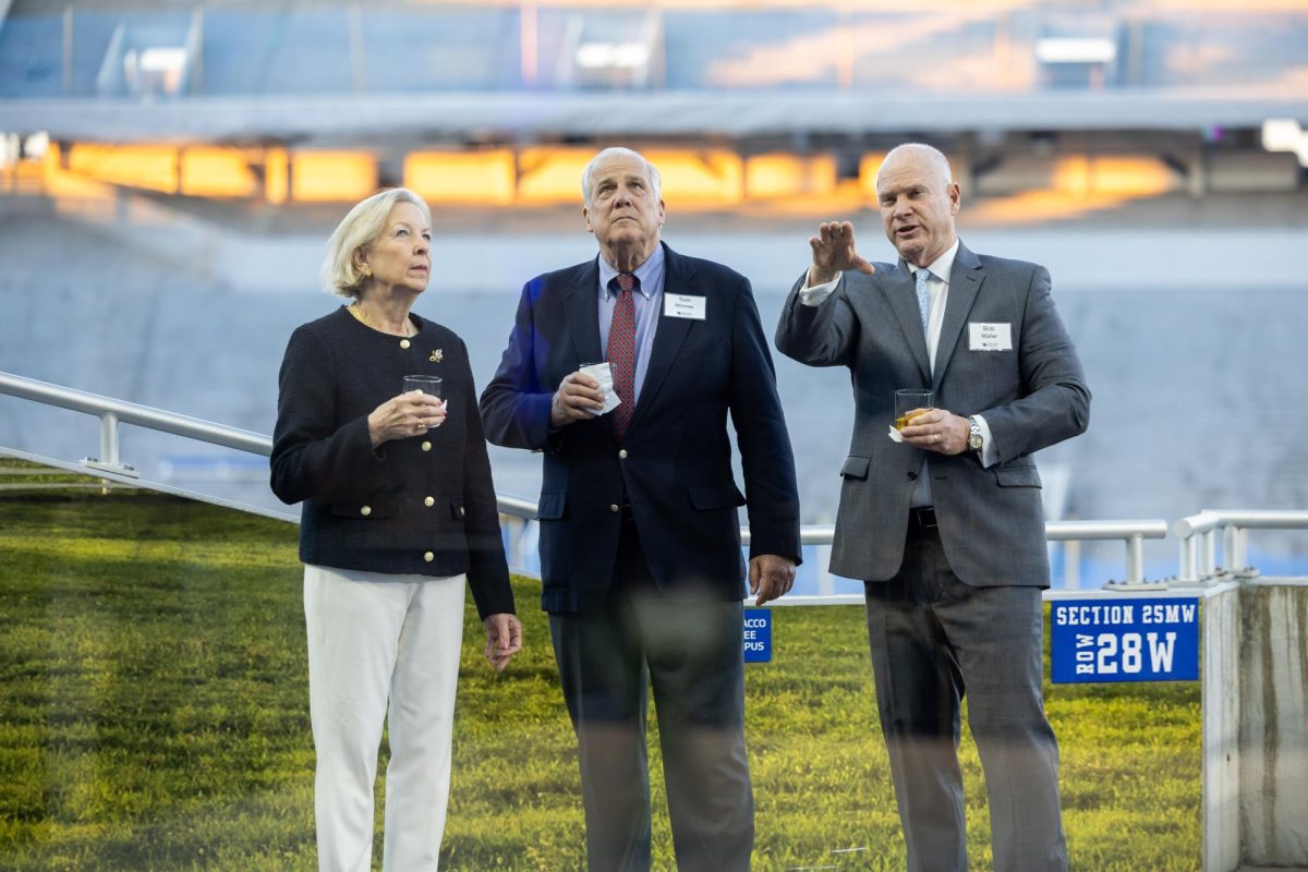 From left to right, Sue Wilmes, Tom Wilmes and Bob Waller  mingle before the award ceremony begins for the Night of Excellence at Kroger Field on Friday, Feb. 20, 2026, in Lexington, Ky. Photo by Brooke Johnson | Kentucky Kernel
