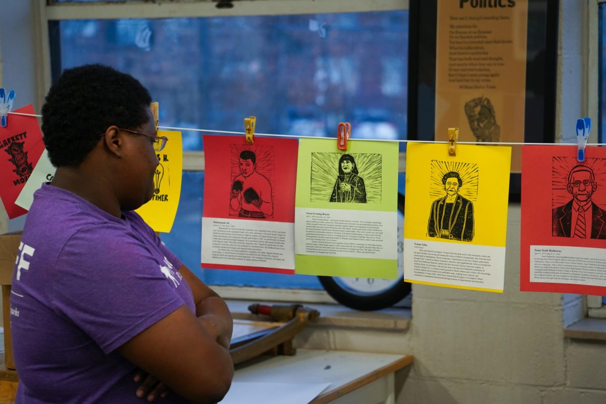 Elizabeth Rankin views artwork created during the Black History Month Printmaking Workshop on Friday, Feb. 20, 2026, in Lexington, Ky. Photo by Dean Snopek | Kentucky Kernel