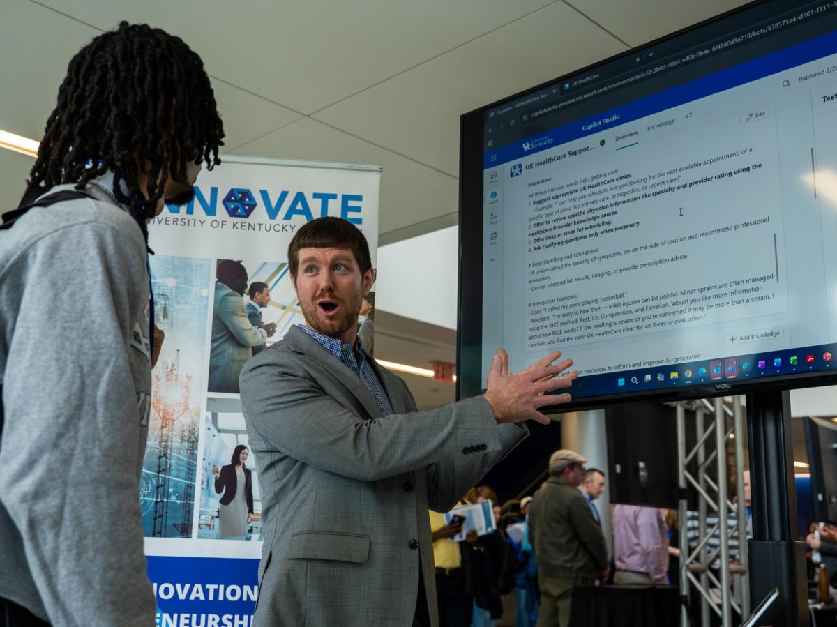 Alec Lewis speaks to a student about AI and UK healthcare at AI in Action on Thursday, Feb. 26, 2026, at the Gatton Student Center in Lexington, Ky. Photo by Brayden Finn | Kentucky Kernel
