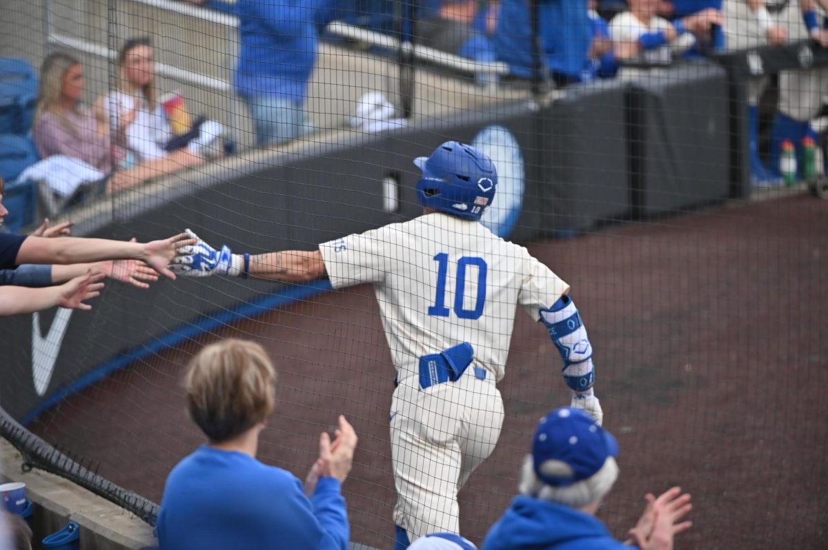 Kentucky shortstop Luke Lawrence high fives fans during the baseball game against Eastern Kentucky on Wednesday, March 4, 2026, at Kentucky Proud Park in Lexington, Ky. Photo by Jack Bates | Kentucky Kernel
