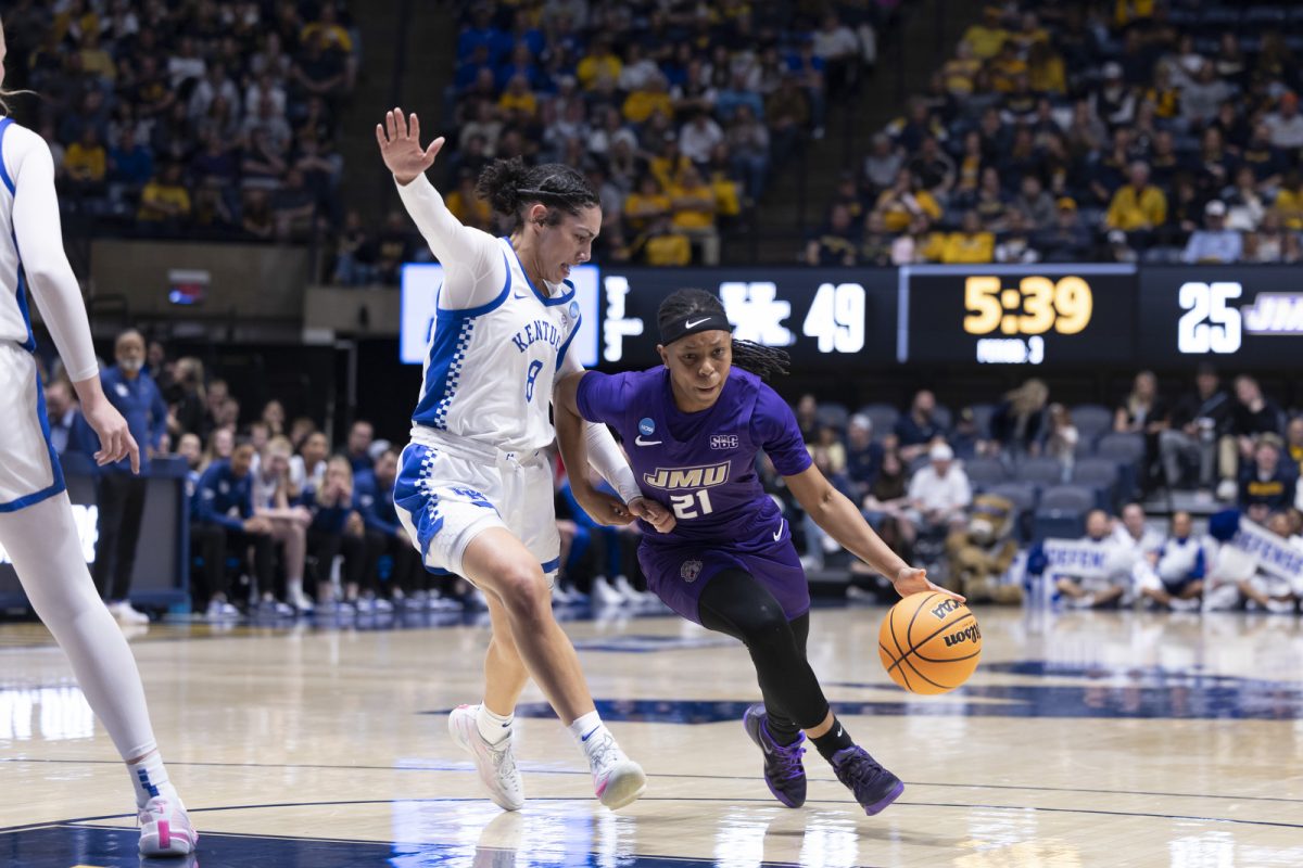 James Madison guard Zakiya Stephenson drives past Kentucky guard Asia Boone during the NCAA women’s basketball tournament game against Kentucky on Saturday, March, 21, 2026, at Hope Coliseum in Morgantown, W.Va. Kentucky won 71-56. Photo by Kate Bonafede | Kentucky Kernel