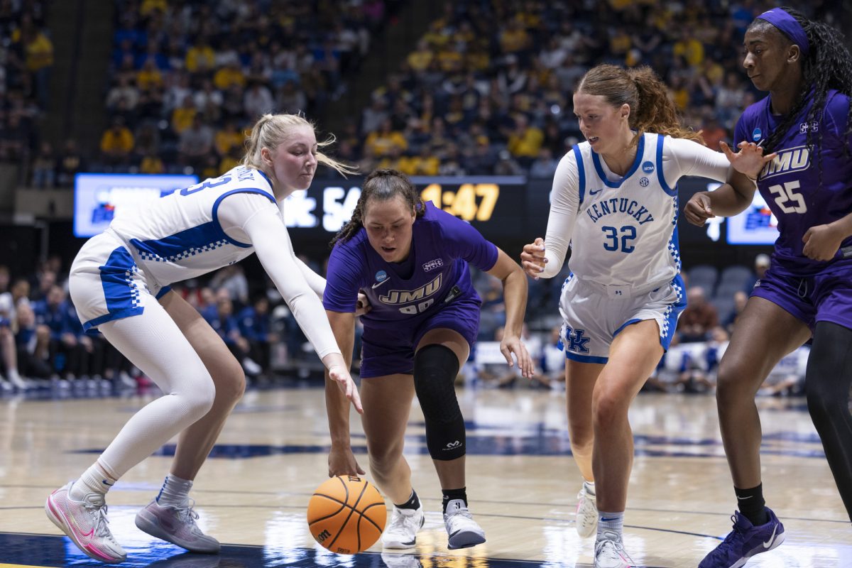 Kentucky center Clara Strack and James Madison guard Peyton McDaniel scramble for the ball during the NCAA women’s basketball tournament game against James Madison on Saturday, March, 21, 2026, at Hope Coliseum in Morgantown, W.Va. Kentucky won 71-56. Photo by Kate Bonafede | Kentucky Kernel