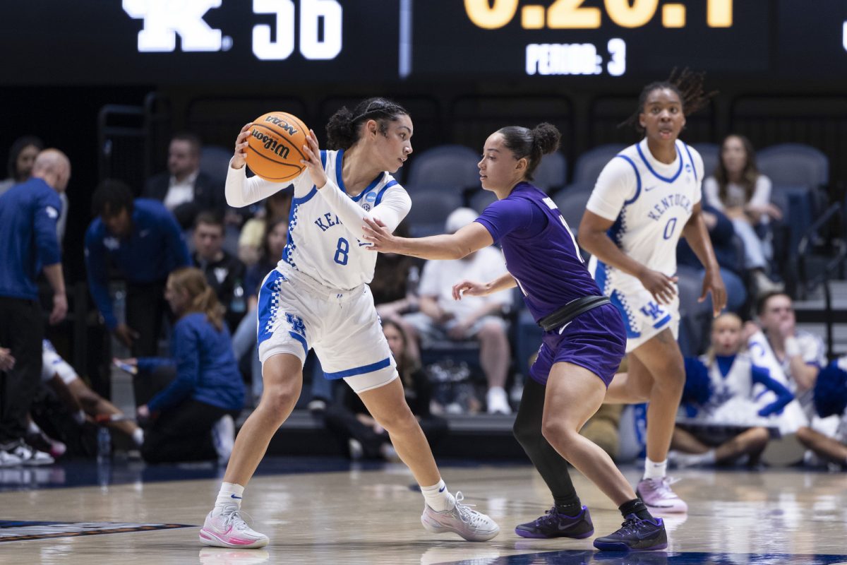 Kentucky guard Asia Boone holds ball away from James Madison guard Bree Robinson during the NCAA women’s basketball tournament game against James Madison on Saturday, March, 21, 2026, at Hope Coliseum in Morgantown, W.Va. Kentucky won 71-56. Photo by Kate Bonafede | Kentucky Kernel