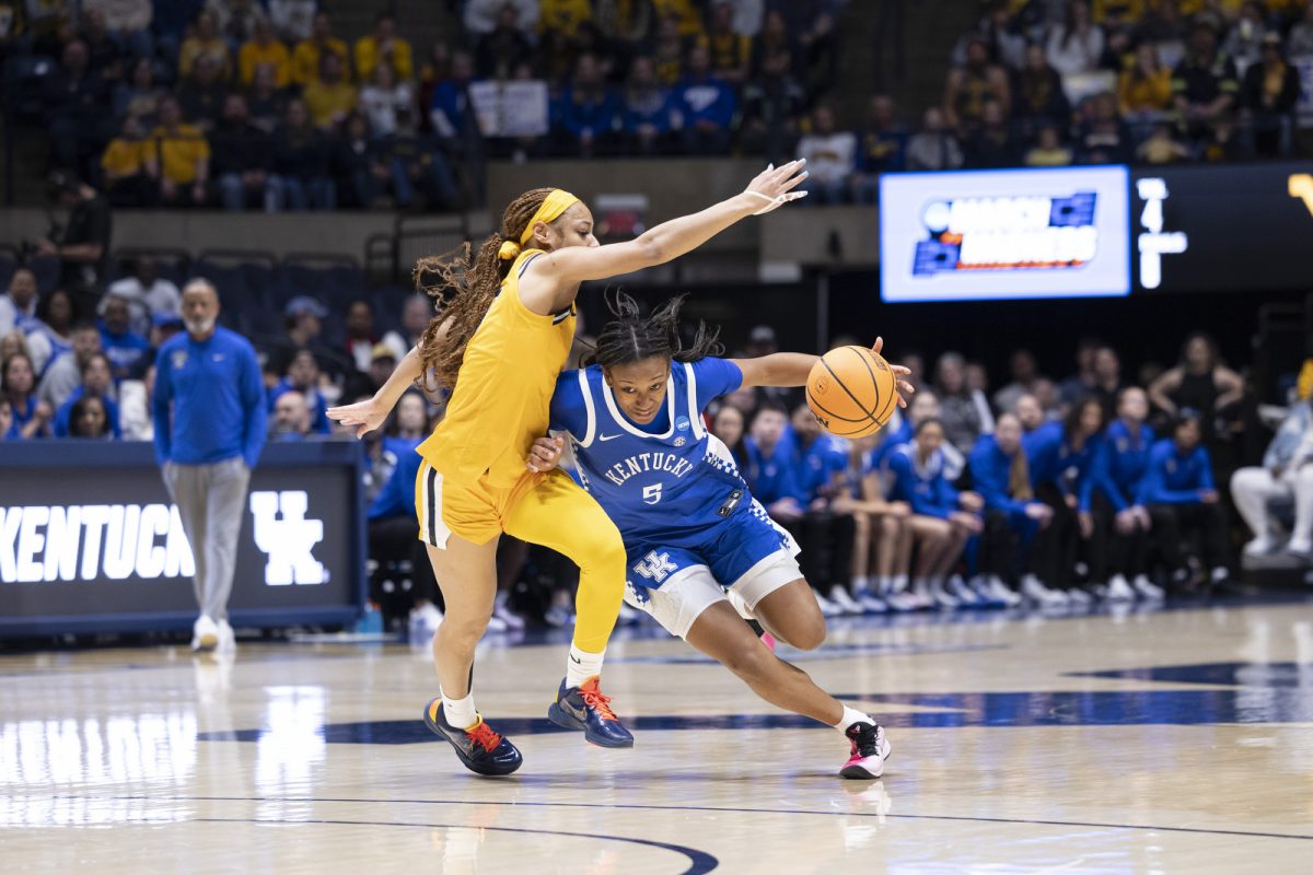 Kentucky guard Tonie Morgan drives past defender during the NCAA women’s basketball tournament game against West Virginia on Monday, March, 23, 2026, at Hope Coliseum in Morgantown, W.Va. Photo by Kate Bonafede | Kentucky Kernel
