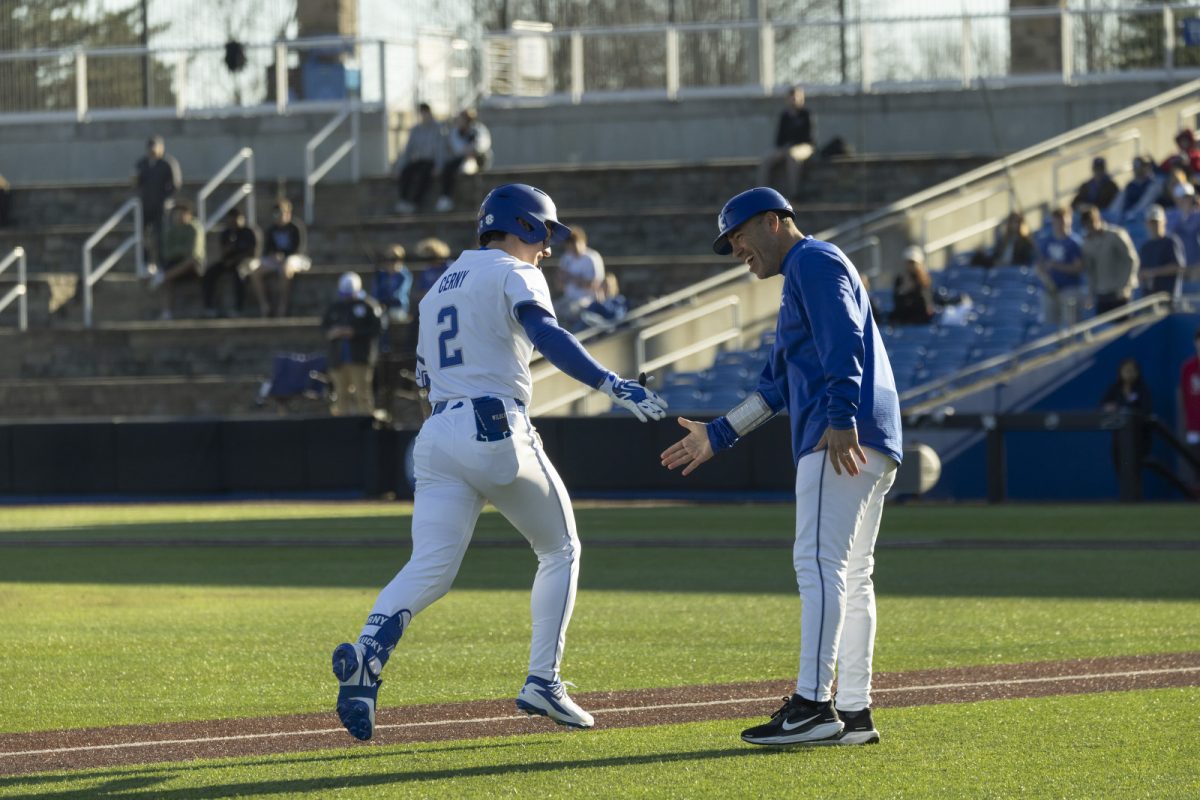Kentucky infielder Tyler Cerny celebrates his home run hit with Kentucky head coach Nick Mingione during the baseball game against St. John’s on Friday, Feb. 27, 2026, at Kentucky Proud Park in Lexington, Ky. Kentucky won 3-1. Photo by Kate Bonafede | Kentucky Kernel