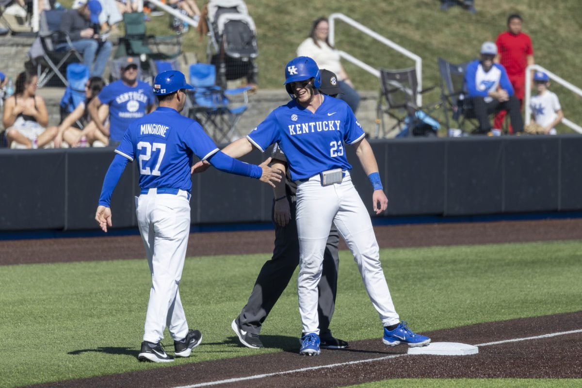 Kentucky infielder Hudson Brown celebrates with Kentucky head coach Nick Mingione during the baseball game against St. John’s on Saturday, Feb. 28, 2026, at Kentucky Proud Park in Lexington, Ky. Kentucky won 3-0. Photo by Kate Bonafede | Kentucky Kernel