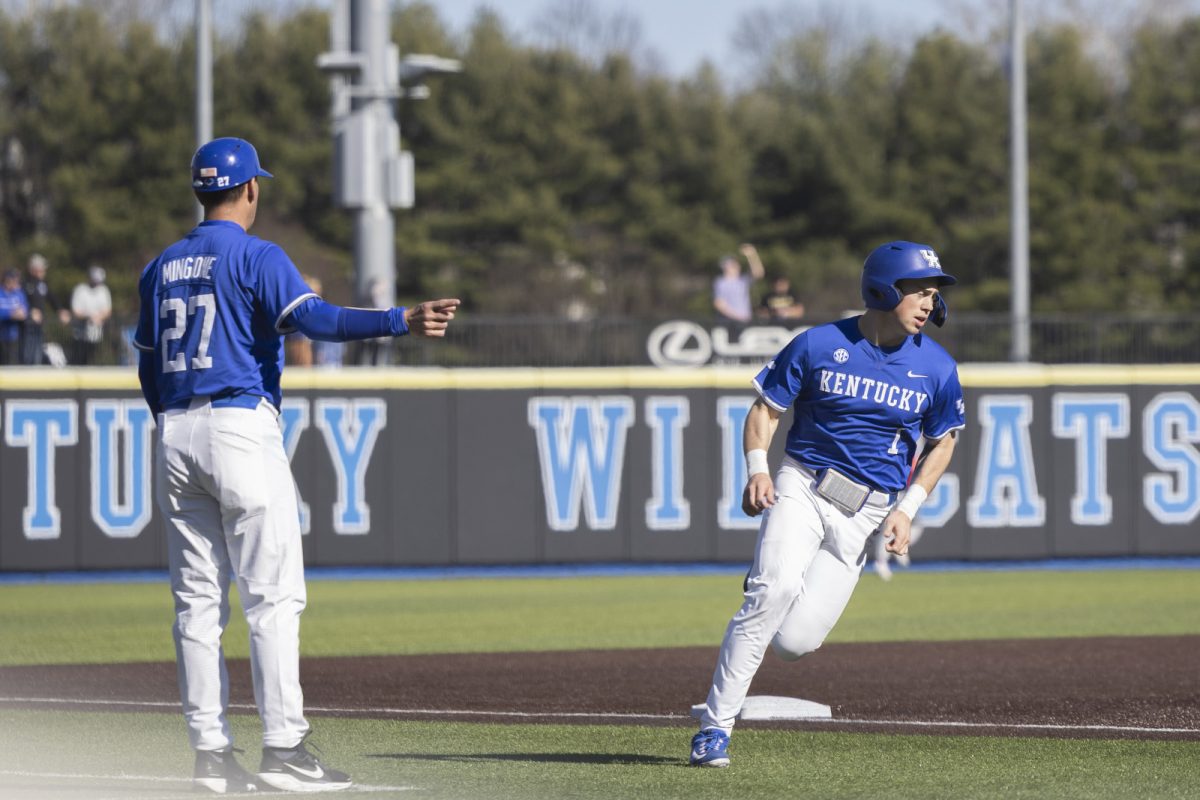 Kentucky infielder Caeden Cloud rounds third base while head coach Nick Mingione points to home plate during the baseball game against St. John’s on Saturday, Feb. 28, 2026, at Kentucky Proud Park in Lexington, Ky. Kentucky won 3-0. Photo by Kate Bonafede | Kentucky Kernel