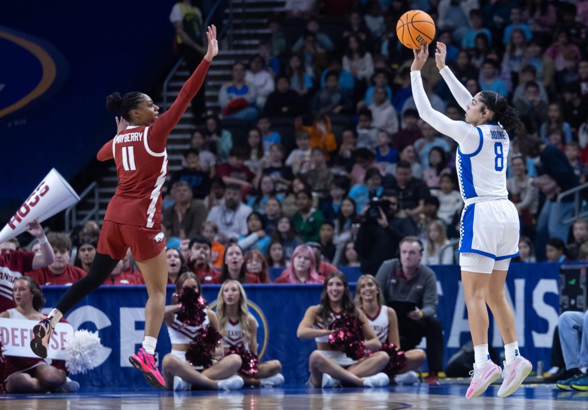 Kentucky guard Asia Boone shoots a 3-pointer over Arkansas guard Wyvette Mayberry during the 2026 SEC Women's Basketball Tournament on Wednesday, March 4, 2026, at the Bon Secours Wellness Arena in Greenville, S.C. Photo by Brooke Johnson | Kentucky Kernel
