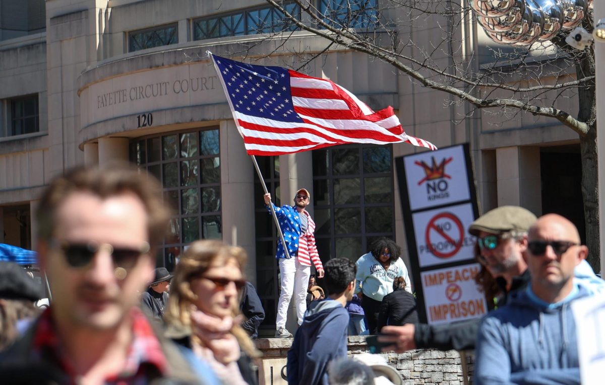 Protestor Tyler Clark waves an American Flag during the “No Kings” protest at the Robert F. Stephens Courthouse Plaza on Saturday, March 28, 2026, in Lexington, Ky. Photo by Brooke Johnson | Kentucky Kernel

