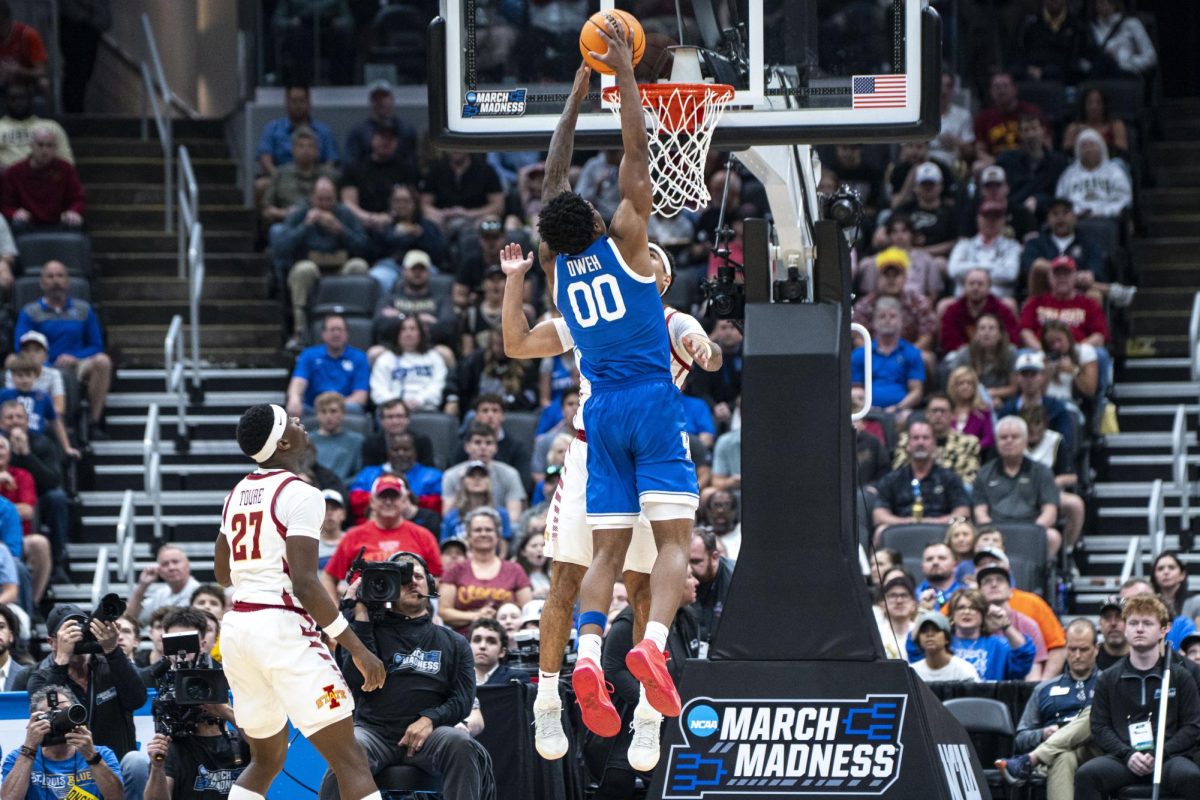 Kentucky guard Otega Oweh dunks on Iowa State guard Tamin Lipsey during the NCAA men's basketball tournament game against Iowa State on Sunday, March 22, 2026, at Enterprise Center in St. Louis, Mo. Photo by Will Luckett | Kentucky Kernel
