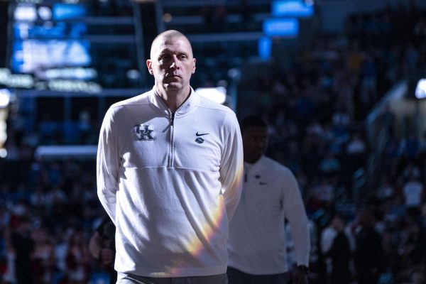 Kentucky head coach Mark Pope watches as the starting lineups get introduced before the NCAA men's basketball tournament game against Santa Clara on Friday, March 20, 2026, at Enterprise Center in St. Louis, Mo. Kentucky won 89-84 in overtime. Photo by Will Luckett | Kentucky Kernel
