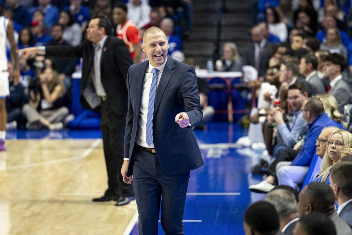 Kentucky Wildcats head coach Mark Pope points at his coaching staff after the Kentucky Wildcats forced a turnover during the basketball game vs. WKU on Tuesday, Nov. 26, 2024, at Rupp Arena in Lexington, Kentucky. Kentucky won 87-68 Photo by Matthew Mueller | Photo Editor
