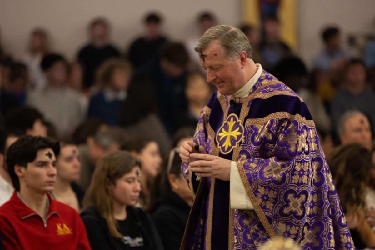 Father Anthony McLaughlin holds ashes on Wednesday, Feb. 18, 2026, at the Holy Spirit Parish Catholic Newman Center in Lexington, Ky. Photo by Laura Ribeiro da Mata Silva | Kentucky Kernel