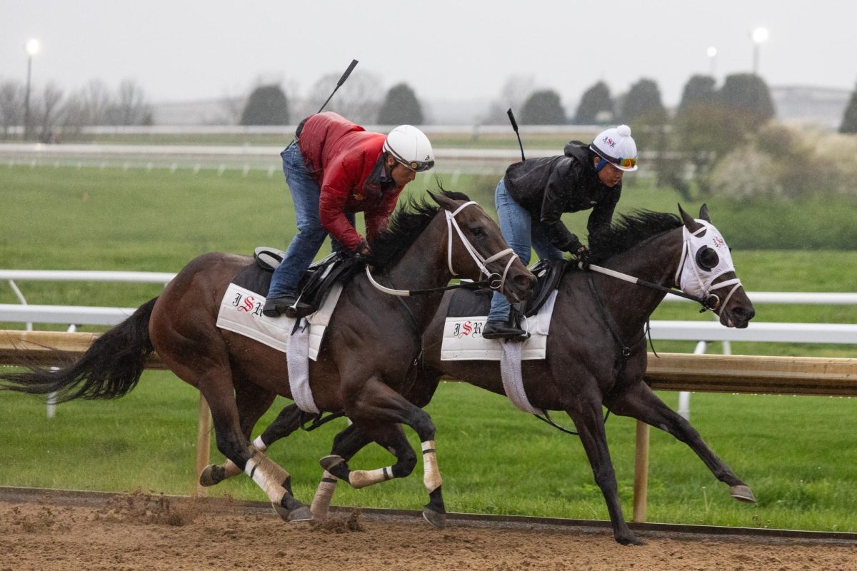 Two horses trained by Joe Sharp run around the main track during Keeneland morning workouts on Friday, April 3, 2026, at Keeneland in Lexington, Ky. Photo by Scout Tarquinio | Kentucky Kernel
