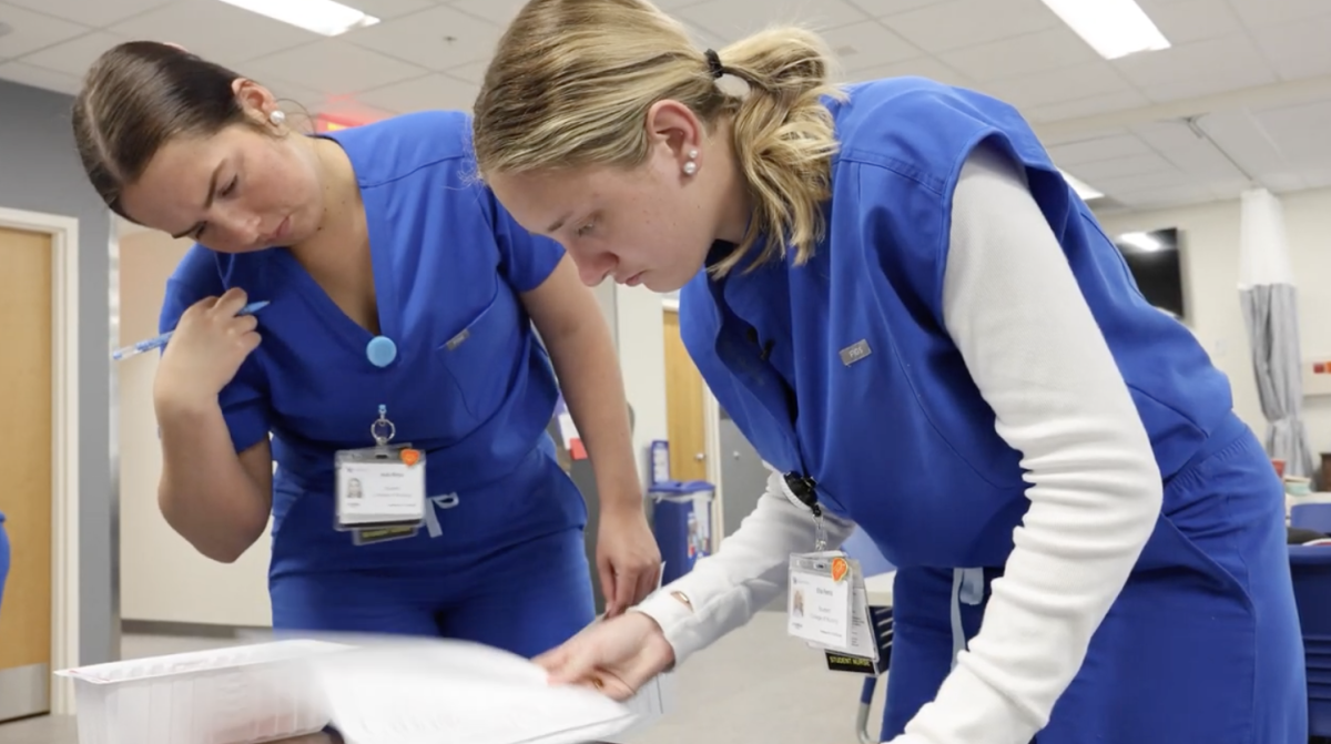 Ella Ferris works with her coworker at the Kentucky Children's Hospital in Lexington, Ky.